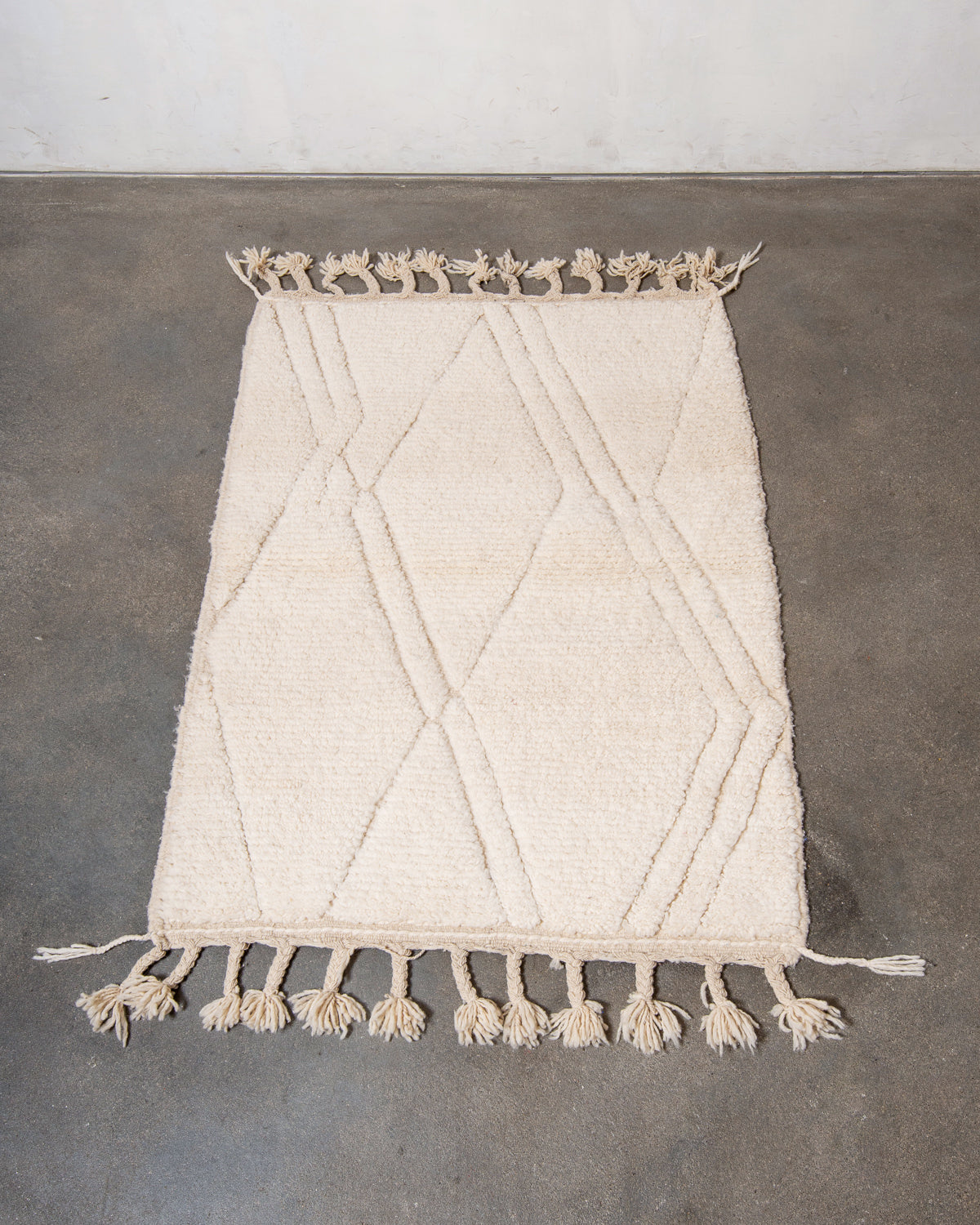 Modern, designer, handcrafted Berber rug from Morocco. Beniourain carpet with minimalist design, natural wool pile and a fluffy texture.